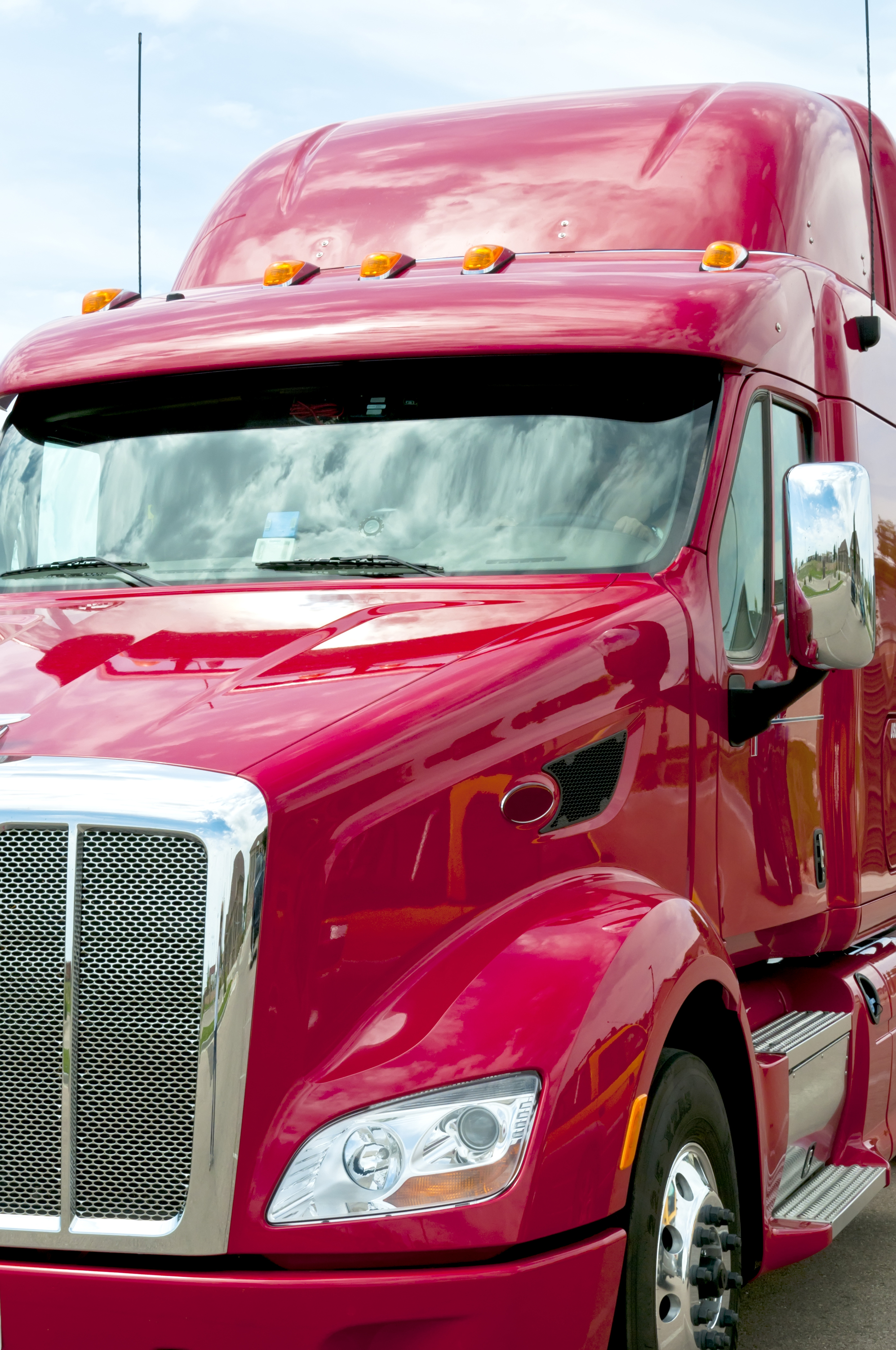 Close Up of a Red Semi_Truck New red semi truck ready to go to work.